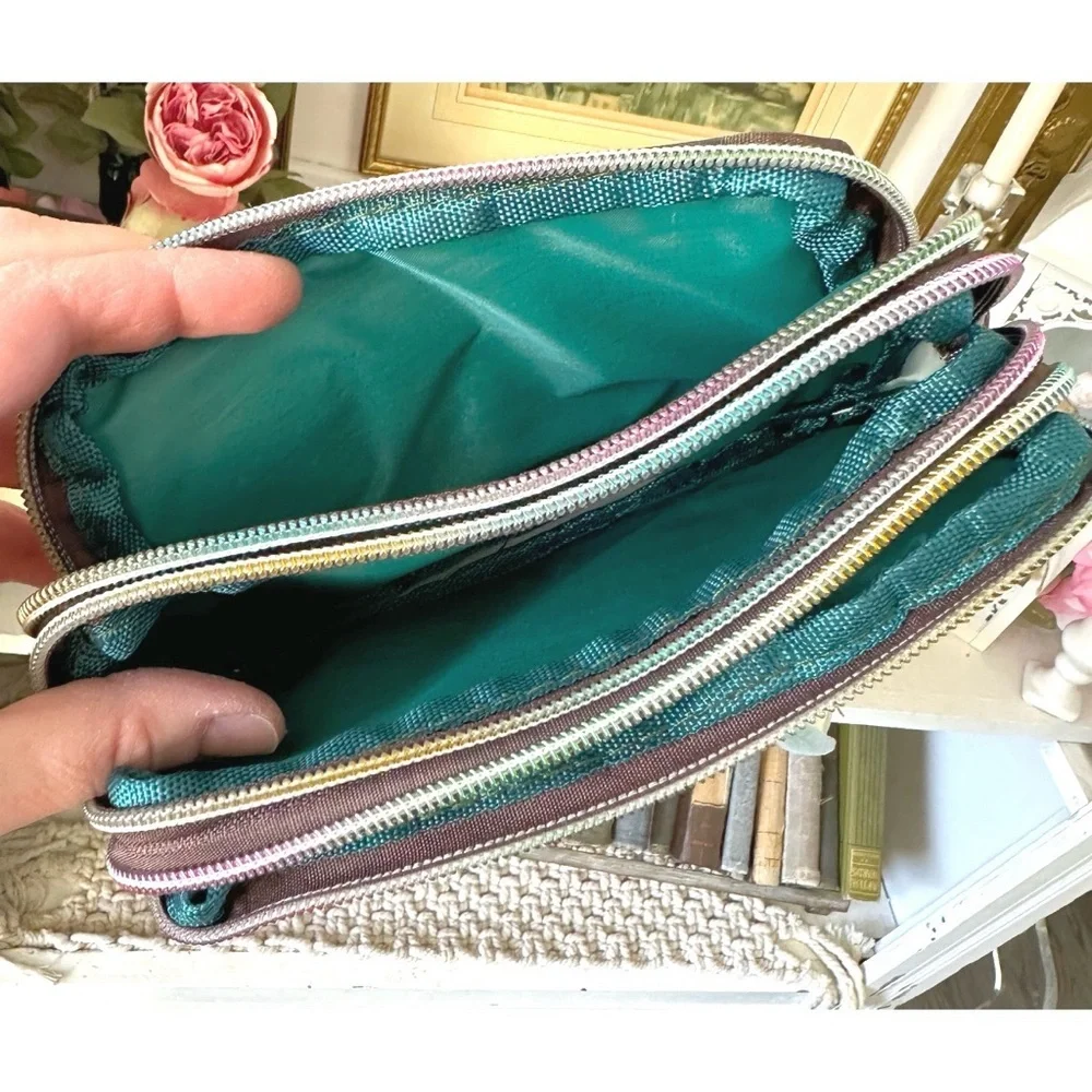 Floral-printed nylon wristlet wallet with three zippered compartments